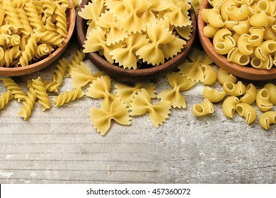 Dried Pasta On Wooden Board