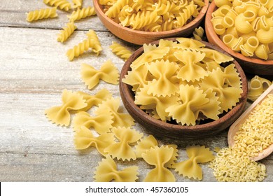 Dried Pasta On Wooden Board