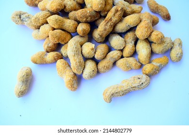 Dried peanuts in closeup isolate  on white background.