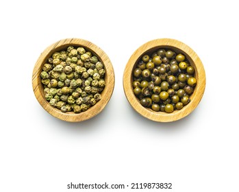 Dried and pickled green peppercorn. Dry green pepper spice isolated on a white background.