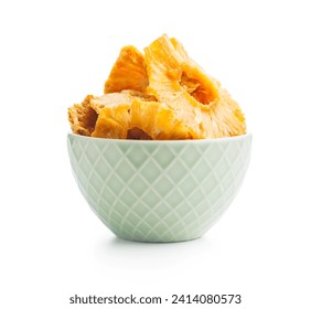 Dried pineapple rings in bowl isolated on the white background.