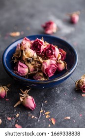 Dried pink rose buds on dark background - Shutterstock ID 1669338838