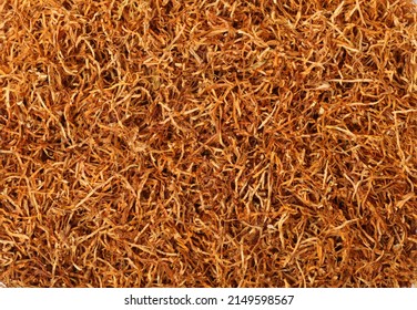 Dried pipe tobacco as background