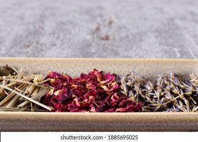 Dried Plants Parts On A Plate. Lavender, Lemongrass, Green Tea And Rose Petals. Self Made Potpourri.