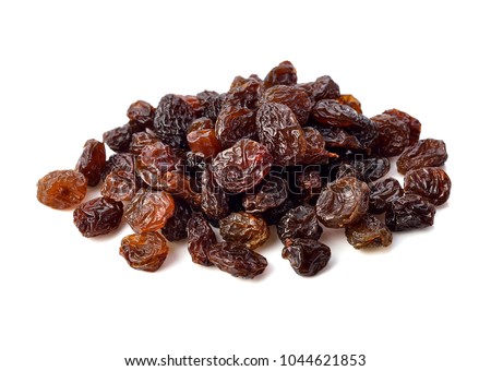 Dried raisins on white background.