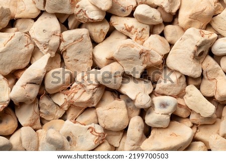 Dried raw Baobab fruit pulp close up full frame as background
