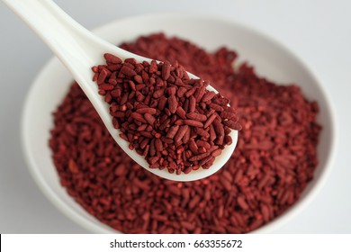 Dried Red Yeast Rice On Bowl And Spoon