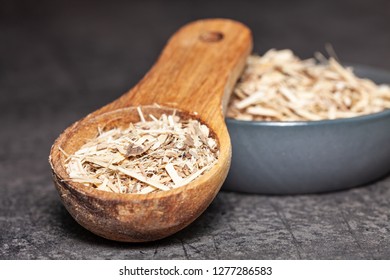 Dried Root Of Siberian Ginseng On Dark Background - Medicine Alternative