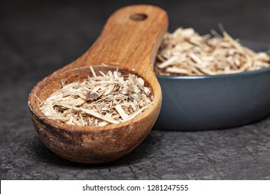 Dried Root Of Siberian Ginseng On Dark Background - Medicine Alternative