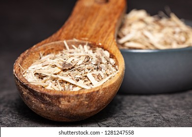 Dried Root Of Siberian Ginseng On Dark Background - Medicine Alternative