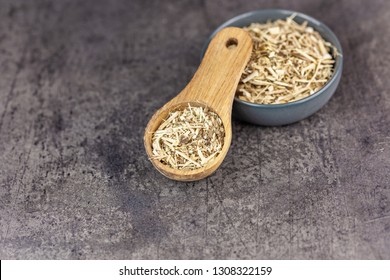 Dried Root Of Siberian Ginseng On Dark Background - Medicine Alternative