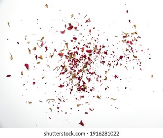 Dried Rose Buds Scattered On White Background.  Red Rose Petals.  Green Leaves.