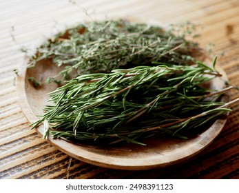 dried rosemary and thyme herb leaves for cooking on clay plate, mediterranean food, - Powered by Shutterstock