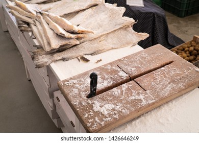 Dried Salted Cod And Cutting Board At Farmers Market