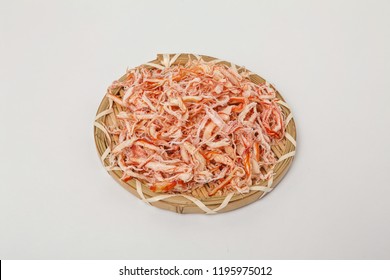 Dried shredded squid on a white background