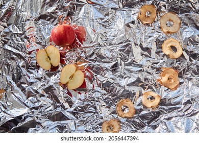 Dried Sliced Apple Chips And Fresh Apples On The Foil Background - Healthy Trendy Snacks. Proper Nutrition Concept. Alternative Snacks For Party Concept. Top View. Copy Space.