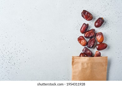 Dried Sliced Date Fruit In Paper Bag On White Background With Copy Space. Snack Vegan Sugarfree Food.