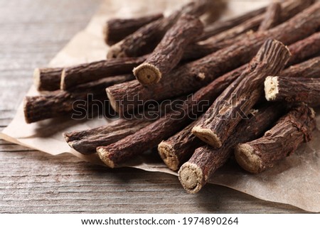 Dried sticks of liquorice root on wooden table, closeup Imagine de stoc © 
