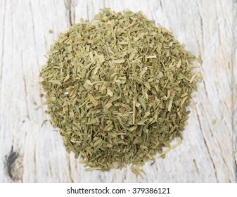 Dried Tarragon Herb Over Wooden Background