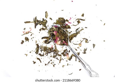 Dried tea flowers. Aromatic flower green chinese tea on white background. Flowering tea or blooming tea isolated on white background.