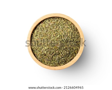 Dried Thyme leaf in wooden bowl isolated on white background. Top view. Flat lay. Clipping path.