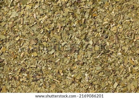 Dried  traditional South American caffeine rich  Mate tea leaves full frame close up as background