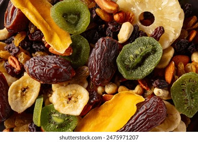 Dried tropical fruits with various nuts and raisins, macro shot, top view. - Powered by Shutterstock