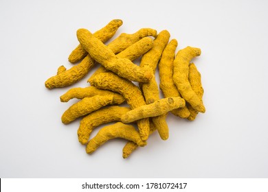 Dried Turmeric Roots or sookhi Haldi as a whole on white background, selective focus