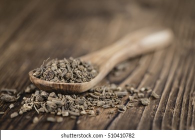 Dried Valerian roots (detailed close-up shot) on wooden background