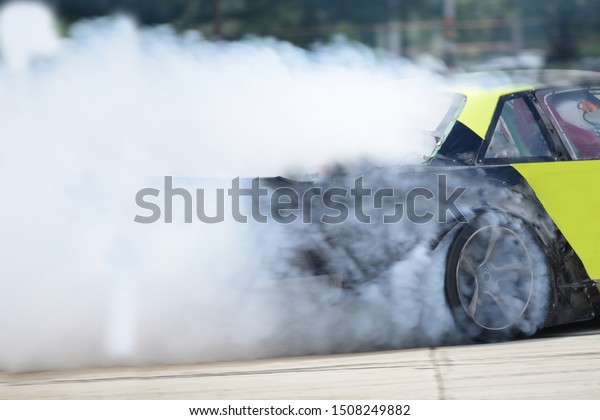 Drift car with  smoke from burning tires\
Motion Blur\
side view drift car 