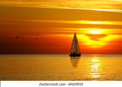 Drifting Boat On A Sunset