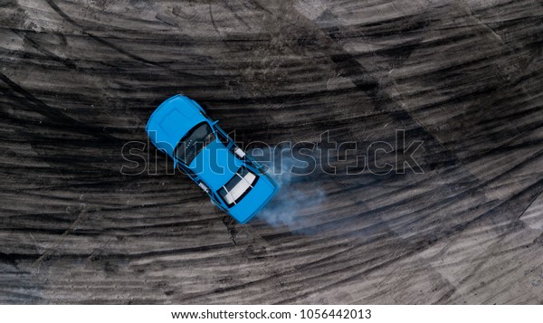 Drifting car, Aerial view professional driver\
drifting car on race track, Abstract texture and background black\
tire tracks skid on asphalt road, Wheel tire tracks background, Car\
tire track skid mark