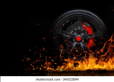 Drifting and fire smoking sport car tire with red breaks isolated on a black background 