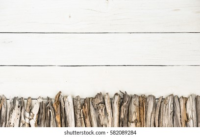 Driftwood Frame Border On White Wood Background.