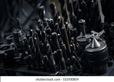 Drill and drill bits close-up.