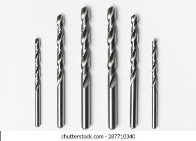 Drill bits of different sizes isolated over white background
