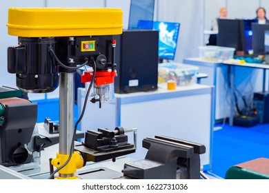 Drill machine close-up planks. The device for drilling holes. Professional drilling machine. Industrial stationary drill. New drilling machine at the exhibition stand. Construction equipment. - Powered by Shutterstock