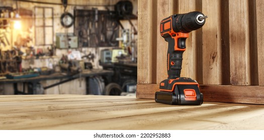 Drill on desk and workshop interior.  - Powered by Shutterstock