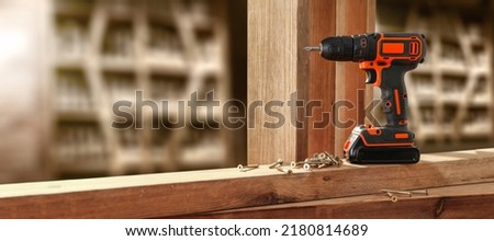 Drill on table and workshop interior. Free space for your decoration. 