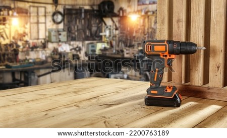 Drill on table and workshop place 