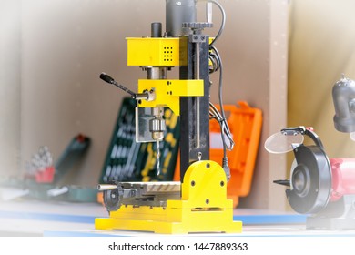 drill press repair equipment for drilling work close up view of professional maintenance service tool for home industrial construction works in modern workshop room background narrow focus photo - Powered by Shutterstock