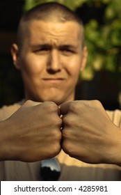 Drill Sargeant In Boot Camp With His Fists Up In The Air