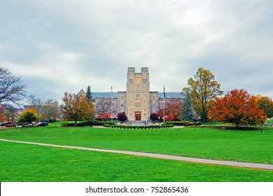Drillfield view of Burrus Hall at Virginia Tech during the fall with orange and maroon colors, Virginia, USA