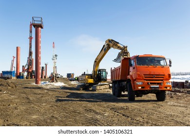 Drilling Equipment, Excavators, Trucks Build The Sea Port Of Sabetta. Yamal, Russia. Winter, Sunny