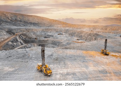 Drilling machine borer installing cast explosives blasting. Banner industry Open coal mine.