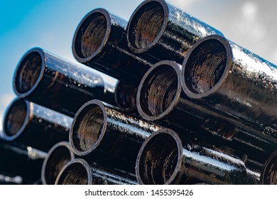 Drilling Of Oil And Gas Wells. Drill Pipe Inspection. Tubing For Oil And Gas Listed On The Pedestal Out Of The Wells After Washing And Ready For Inspection. Stack Of Casing Laying On The Deck.