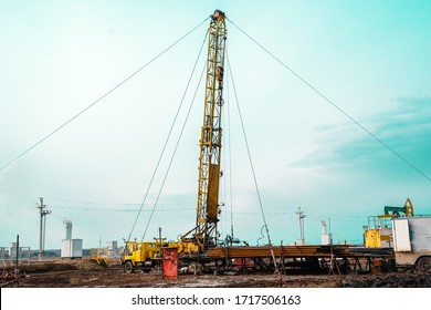 Drilling An Oil Well And Conducting Geophysical Surveys To Increase Oil Production. An Oil Well Engineer Works From The Back Of Specialised Van To Log The Condition Of Steel Casing Inside An Oil Well.