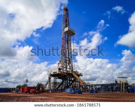 Drilling Rig with dramatic sky in dessert area