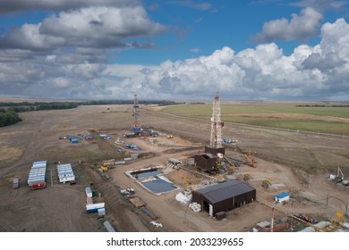 Drilling Rig In Oil Field For Drilled Into Subsurface In Order To Produced Crude. Petroleum Industry. Drone View.