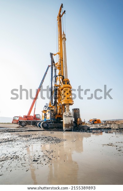 Drilling rig on a construction site. Drilled\
piles for the bridge foundation.\
